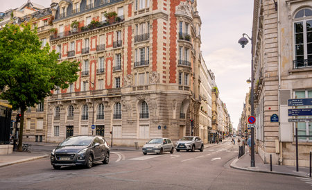 Paris, France 08 04 2023: Cars in front of 2 Rue Guynemer historic six-storey building of Neo-Louis XIII and Baroque style built in 1914 by Louis Perinat at the intersection with the Rue de Vaugirardのeditorial素材