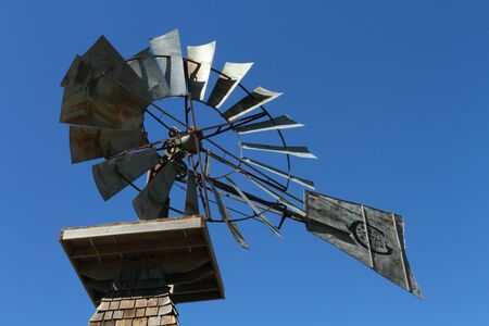 Old fashioned windmill on blue skyのeditorial素材