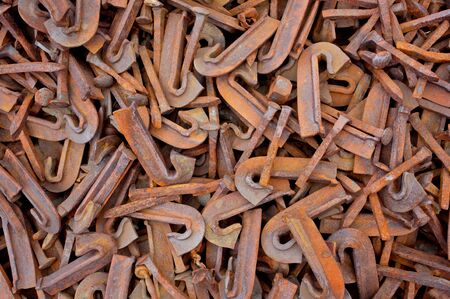 Pile of scrap metal spikes from railway constructionの写真素材