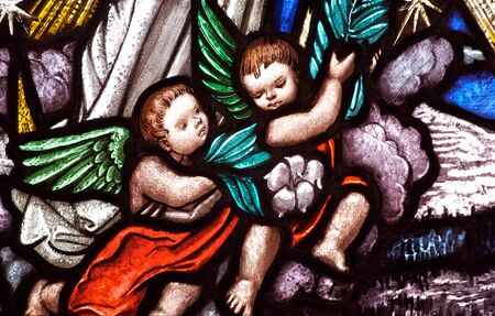 Stained glass church window depicting cherubic angelsのeditorial素材