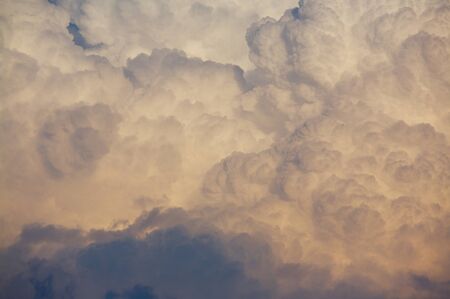 Huge cumulonimbus type thunder cloud forming in the evening sky.