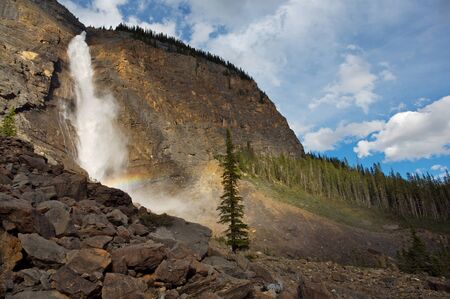 Takkakaw Waterfalls with rainbow in Yoho National Park, British Columbia, Canadaの写真素材