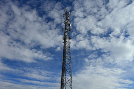 Large telecommunication tower with dramatic clouds in the skyの写真素材