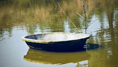 Concrete made round shape pots to feed the fish in the pondの写真素材