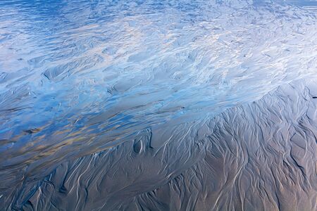 low-tide ocean water texture, location - New Zealandの写真素材