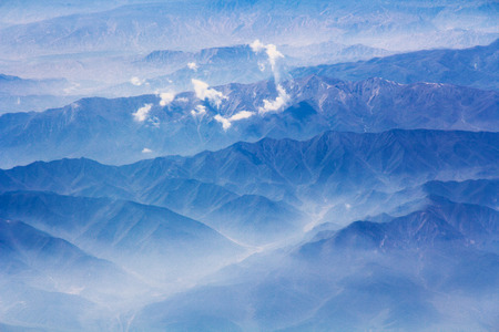 Beautiful mountains and clouds landscape - aerial viewの写真素材