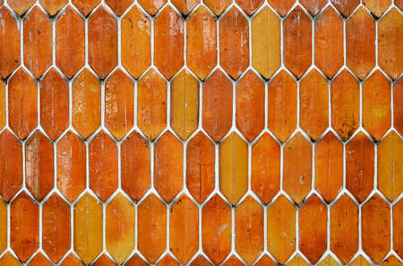 The brown hexagon wall tiles as background の写真素材
