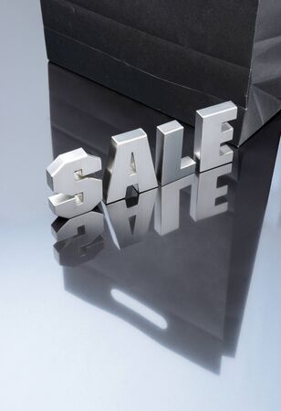 Sale silver text with paper bag for shopping promotionの写真素材