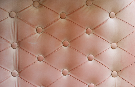 vintage pink sofa leather backgroundの写真素材