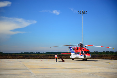 fireman is guarding for offshore helicopter before start up engineのeditorial素材