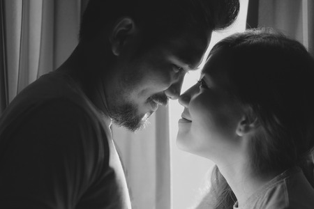 happiness and romantic scene of love asian couples partners making eye contactの写真素材