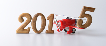 New year 2015 sign made by wooden number and red airplaneの写真素材