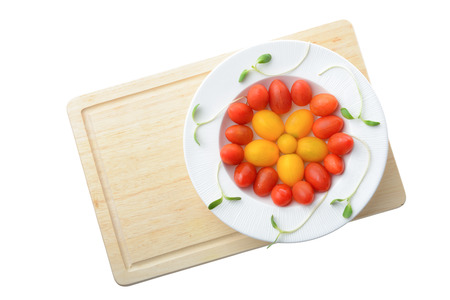 fresh cherry plum tomato on white plate isolated on white background,Healthy eating conceptの写真素材