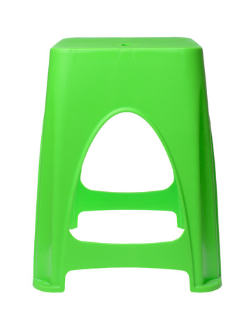 The dirty green plastic chair isolated on whiteの写真素材