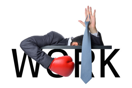 businessman surrender with work by show hand up with neck tie isolated on whiteの写真素材