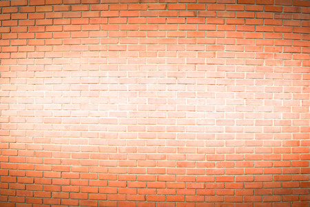 brown brick wall is painted white in the middle for texture backgroundの写真素材