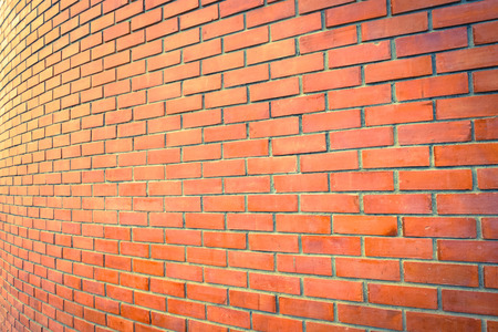 curve brown brick wall perspective for a backgroundの写真素材
