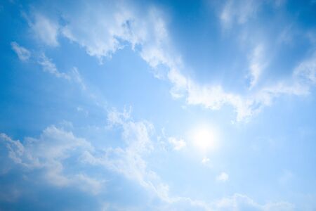 Strong sun and moving skyの写真素材