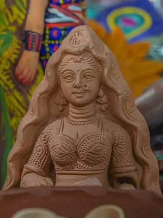 selective focus of a small sand statue of a traditional indian womanの写真素材