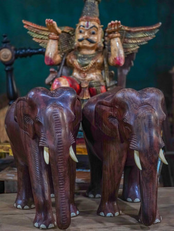 selective focus on two wooden statues of elephantsの写真素材