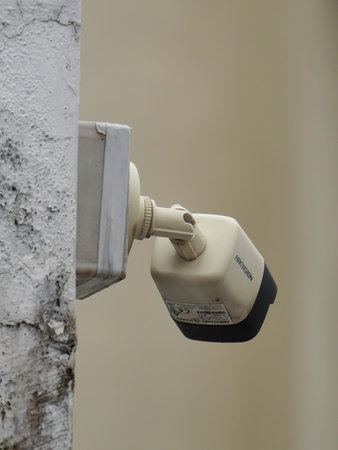 selective focus on a surveillance camera which is mounted on a wall