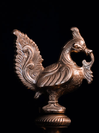 selective focus on a vintage bird's statue made by bronzeの写真素材