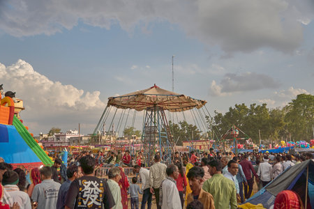 Sikar, India ; 04-10-2023 : a A horizontal swing wheel in a fair ,carouselのeditorial素材