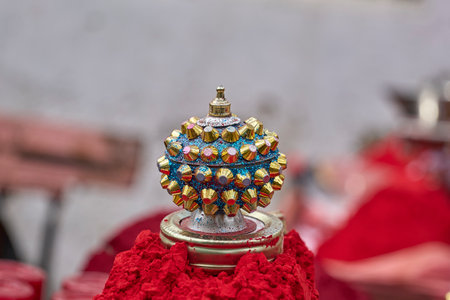 A beautiful indian ornament on the red powderの写真素材