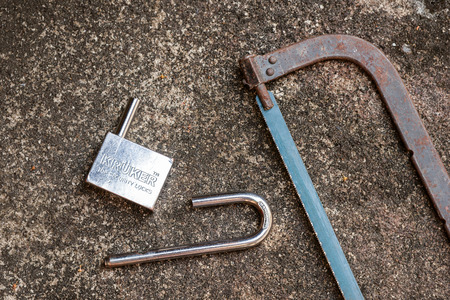 damage the lock by hand sawの写真素材