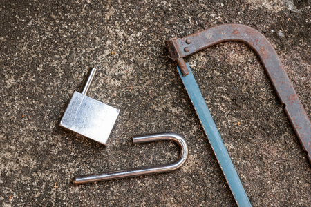 damage the lock by hand sawの写真素材
