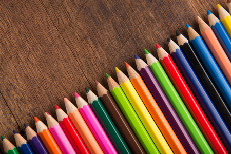 Group of colorful pencils on the wood table  background artwork gallery equipment tool conceptの写真素材