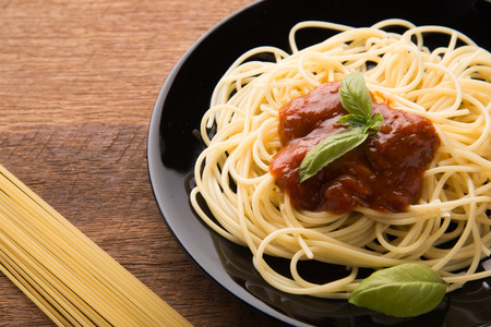 Plate of delicious spaghetti Bolognaise or Bolognese with savory minced beef and tomato sauceの写真素材