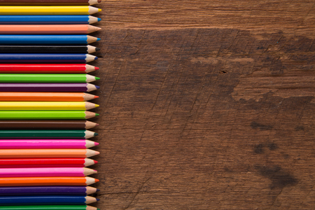 Group of colorful pencils on the wood table  background artwork gallery equipment tool conceptの写真素材