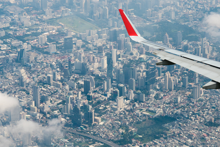 View from airplane cityscape Bangkok skyline, Thailand. Bangkok is metropolis and favorite of tourists live at between modern building / skyscraper, Community residents and various religions buildings are peacefullyの写真素材