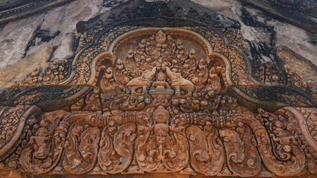 Khmer architecture carved red stone in Banteay Srei temple .Banteay Srei is one of the most popular ancient temples in Siem Reap, Banteay Srei, known for its beautiful carvings on red sandstone Cambodiaのeditorial素材