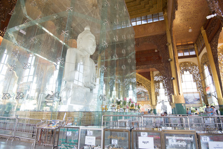 15 December 2016 Buddhist myanmar people praying in front of white marble buddha image at Kyauk Taw Gyi Pagoda Largest marble Buddha image in Burma , yangon , myanmarのeditorial素材
