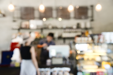Coffee shop and restaurant blurred background with customerの写真素材