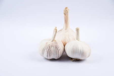 Isolated sliced garlic, group of garlic white backgroundの写真素材