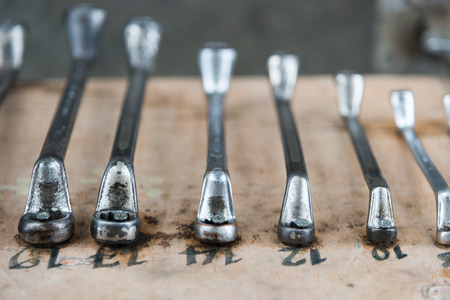 wrenches on garage wall, set of wrenches handy industrial tool,old wrenches in mechanic...