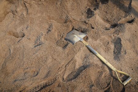Shovel placed used for scoop sand in construction work.sand material for construction workの写真素材