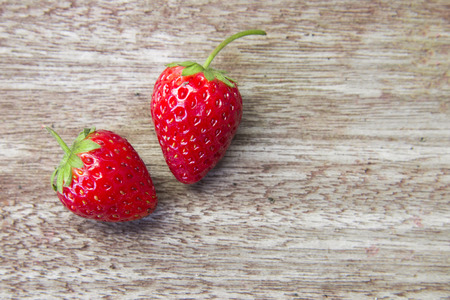 Fresh strawberries on wooden table,Red strewberry prepatation to make Strawberry Juice.Healthy and delicious organic fruit の写真素材