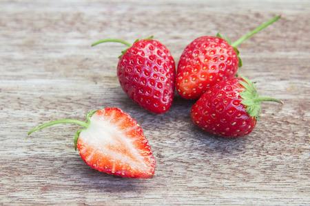 Fresh strawberries on wooden table,Red strewberry prepatation to make Strawberry Juice.Healthy and delicious organic fruit の写真素材