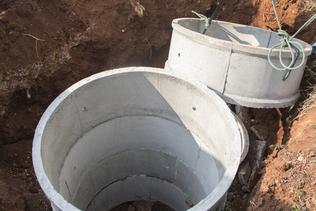 cement pipe tank,treatment waste water in asian house construction site for toiletの写真素材