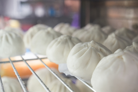 steamed stuff bun favorite tradtional chinese food in asia.It is a popular snack sold mostly in Chinese restaurants.Another name is Siopao made from a combination of pork, chicken, beef, shrimp.の写真素材