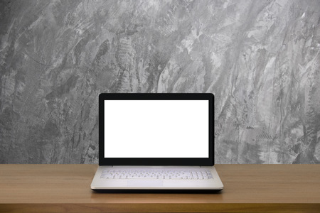 Mock up Laptop with blank screen on wooden table with modern interior background.Mock up business concept.の写真素材