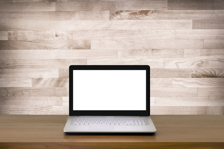 Mock up Laptop with blank screen on wooden table with modern interior background.Mock up business concept.の写真素材