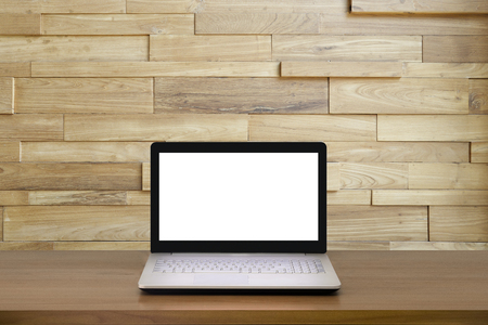 Mock up Laptop with blank screen on wooden table with modern interior background.Mock up business concept.の写真素材