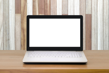 Mock up Laptop with blank screen on wooden table with modern interior background.Mock up business concept.の写真素材