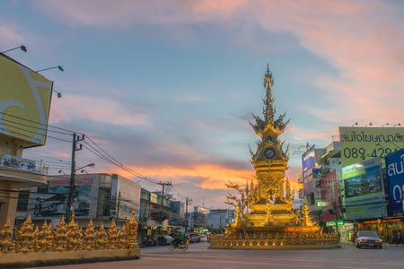 Chiangrai,Thailand -06-September-14 Chiangrai Golder Clock tower designed by Thai artist Chalermchai Khositpipat.it is a famouse place for tourist attraction.のeditorial素材