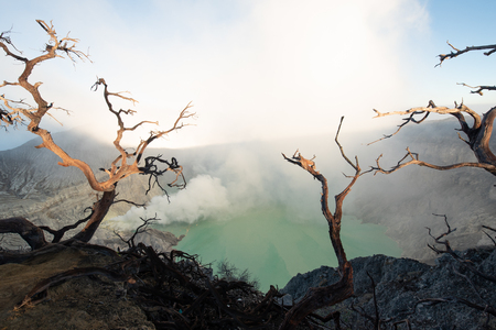 Kawah Ijen volcano complex is a group of composite volcanoes in the Banyuwangi Regency of East Java, Indonesia.Kawah Ijen at Sunrise. The most famous tourist attraction in Indonesiaの写真素材